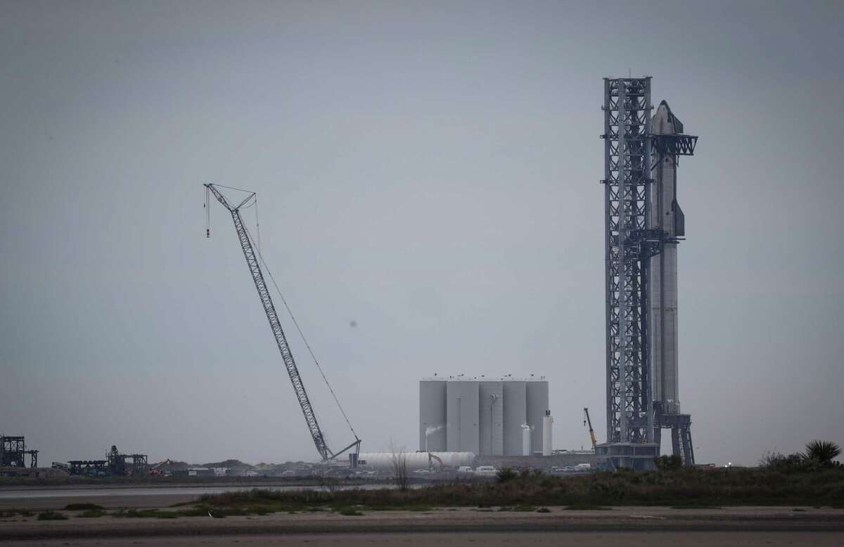 A Starship spacecraft sits stacked atop the Super Heavy rocket Thursday, Feb. 10, 2022, in Boca Chica.