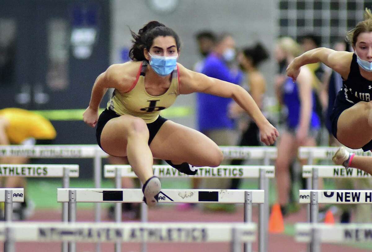 Joel Barlow’s Mariella Schweitzer competes in the 55-meter hurdles final during the Class M indoor track championships in New Haven on Thursday.