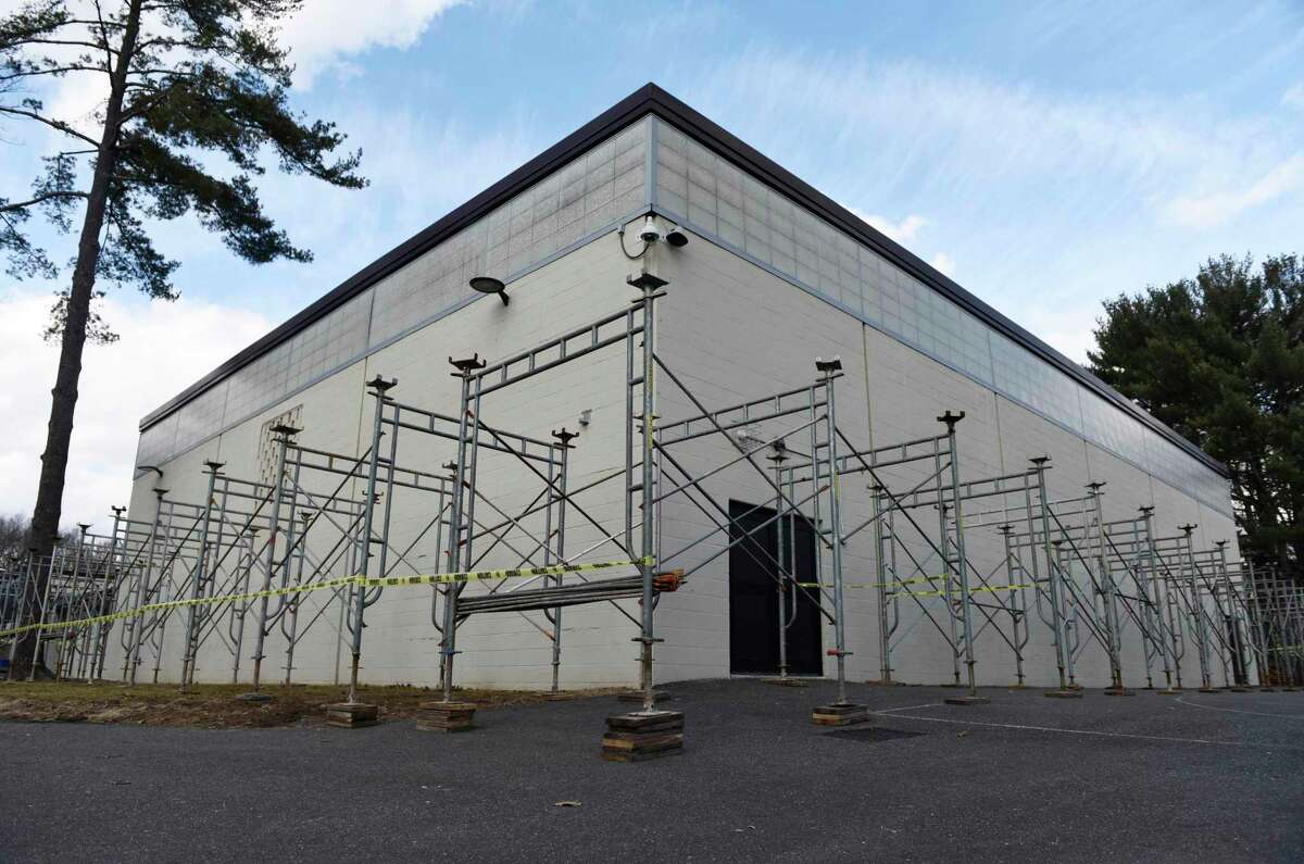 Scaffolding is put up outside the gym area at Central Middle School in Greenwich, Conn. Thursday, Feb. 10, 2022. The RTM gave wide support to funding the emergency repairs, which will continue over the summer.