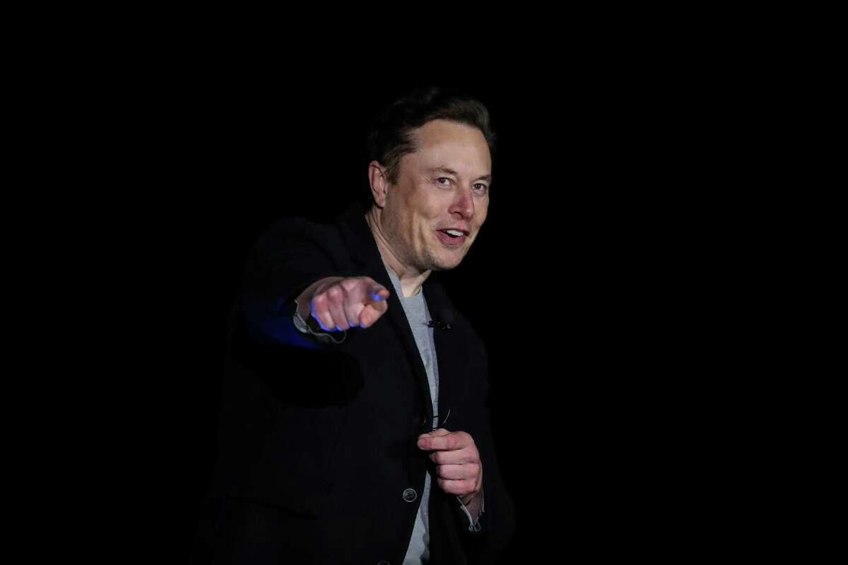 Elon Musk, founder of SpaceX, answers a question from a reporter about whether he will attend a local festival during a Starship update press conference Thursday, Feb. 10, 2022, at a SpaceX facility in Boca Chica.