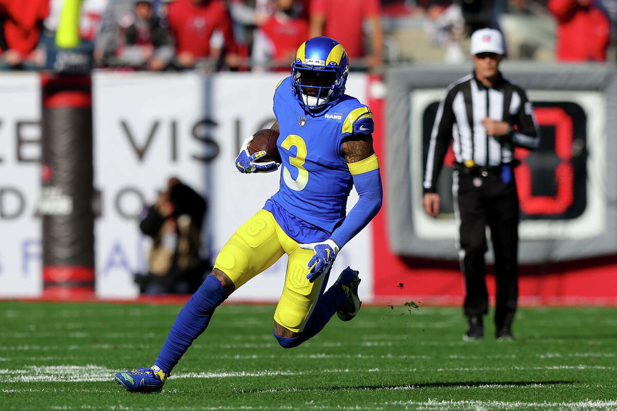 Odell Beckham Jr. of the Los Angeles Rams runs with the ball in the first quarter of the game against the Tampa Bay Buccaneers in the NFC Divisional Playoff game at Raymond James Stadium on January 23, 2022 in Tampa, Florida.