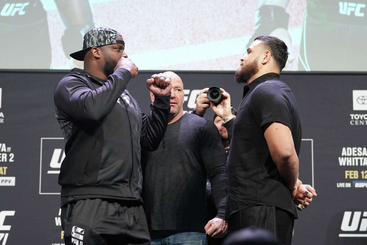 Opponents Derrick Lewis and Tai Tuivasa face off during the UFC 271 press conference at George R. Brown Convention Center on February 10, 2022 in Houston.