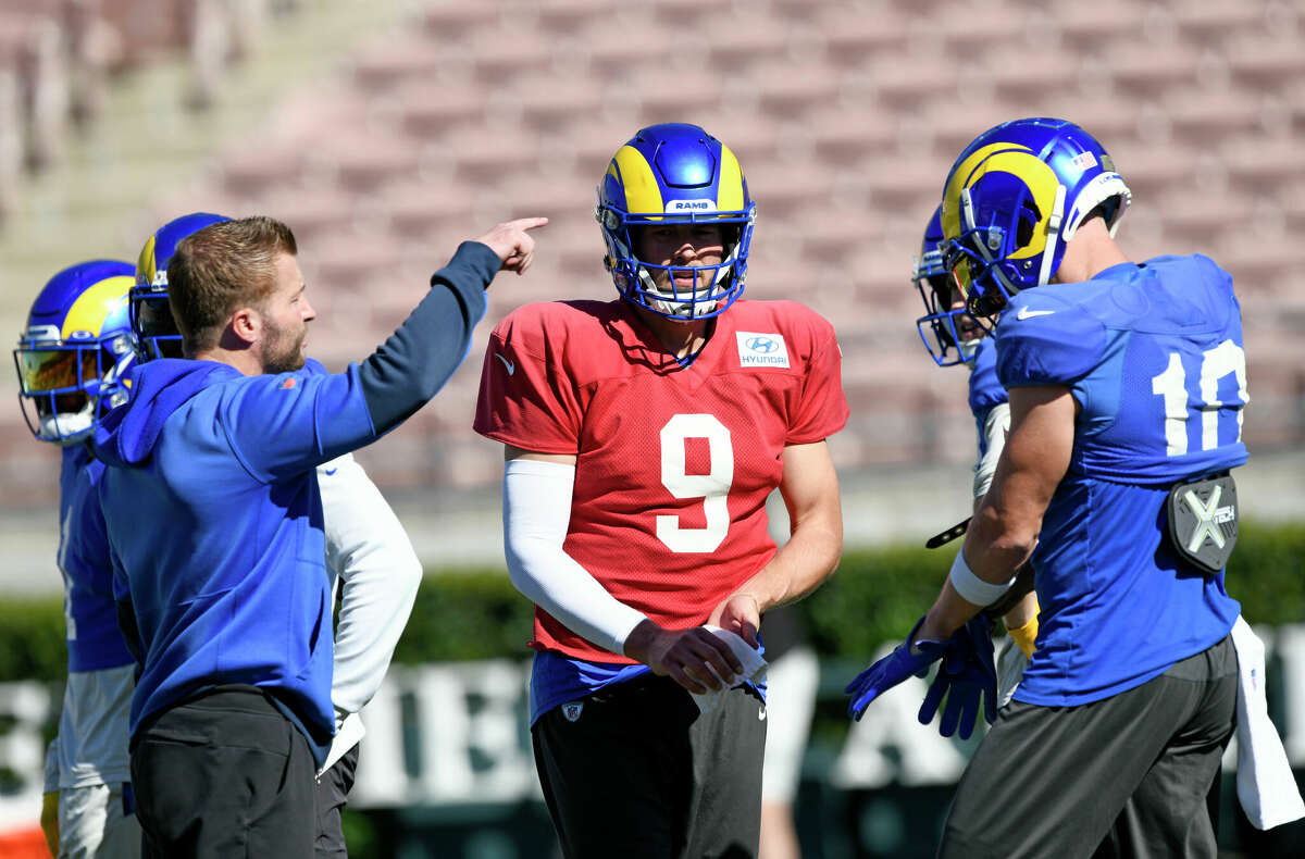 Los Angeles Rams wide receiver Cooper Kupp, left, talks with quarterback Matthew  Stafford durin …