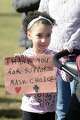Sydney Palmer, a 7-year-old first grader from Watertown, attends a rally in front of The Catholic Center, in Bridgeport, Conn. Feb. 11, 2022. While Palmer attends a Catholic school in the Diocese of Hartford, her mother, Ashley Audin, decided to travel to Bridgeport to show support for parents and students from the Diocese of Bridgeport who organized the Friday rally following a recent decision for area Catholic schools to go mask-optional at the end of the month.