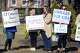 Several dozen people turned out for a rally in front of The Catholic Center, in Bridgeport, Conn. Feb. 11, 2022. The rally was organized to show support following a recent decision for area Catholic schools to go mask-optional at the end of the month.