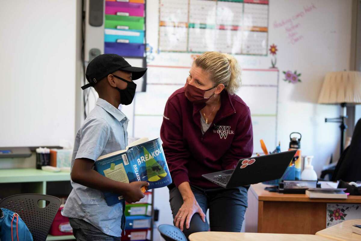 Mrs. Megan Christian with a Middle School student. Wooster School in Danbury has established a fellowship program to attract and retain teachers of color. The fellows would teach at Wooster for two years, while having the opportunity to earn their master’s degree through Mount Holyoke College.