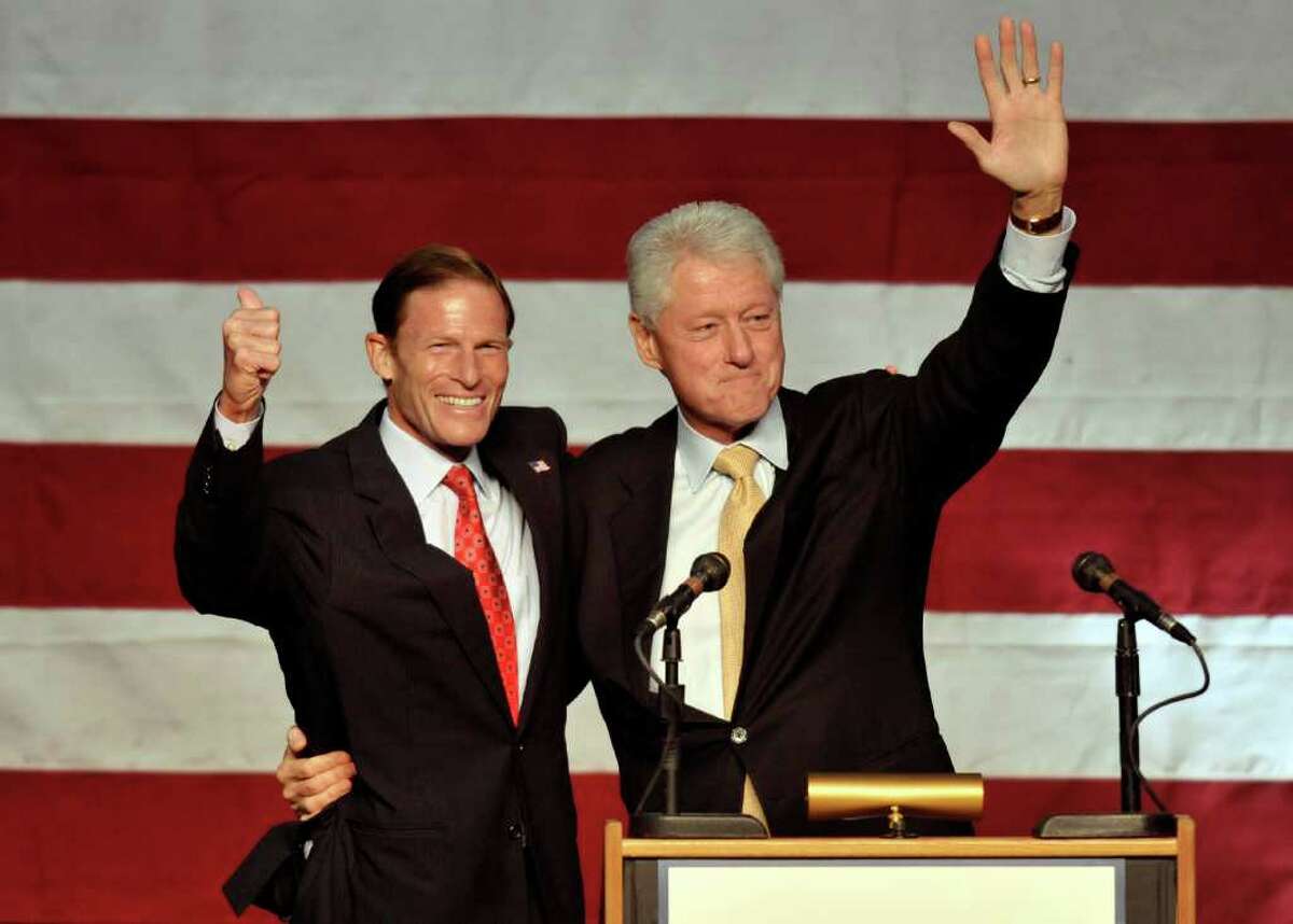 Former President Bill Clinton, right, campaigns for Democratic U.S. Senate candidate Richard Blumenthal, left, in New Haven, Conn., on Sunday, Sept. 26, 2010. (AP Photo/Jessica Hill)