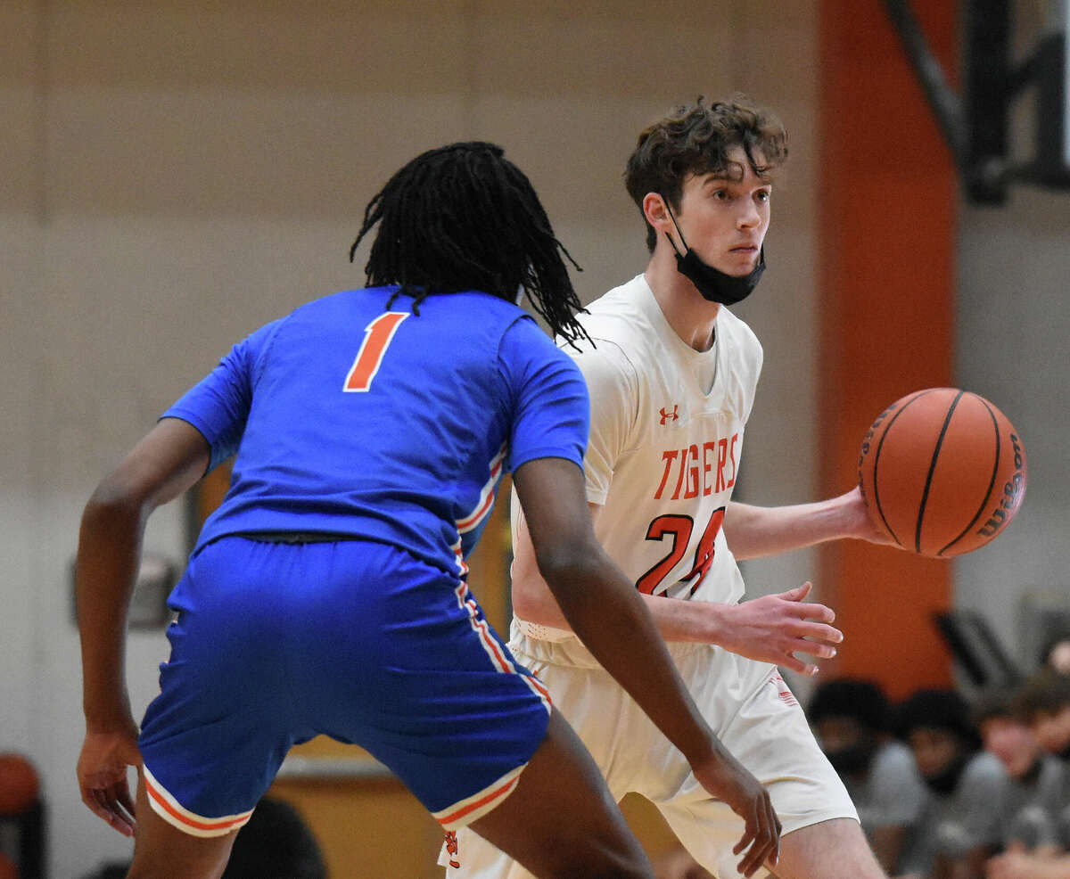 Edwardsville's Jake Siebers runs offense during the first quarter against East St. Louis on Friday inside Lucco-Jackson Gymnasium in Edwardsville.