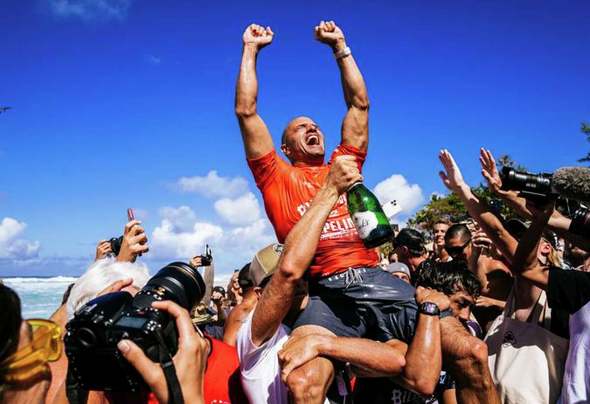 Kelly Slater celebrates after winning the Billabong Pro Pipeline on Feb. 5 in Haleiwa, Hawaii. Slater won the contest just short of his 50th birthday.