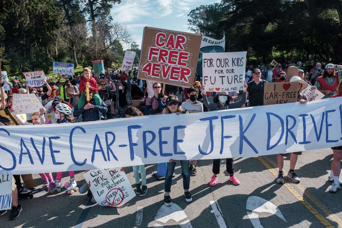 Hundreds of people march and ride during a “Save JFK” rally on JFK Drive in Golden Gate Park on Saturday,