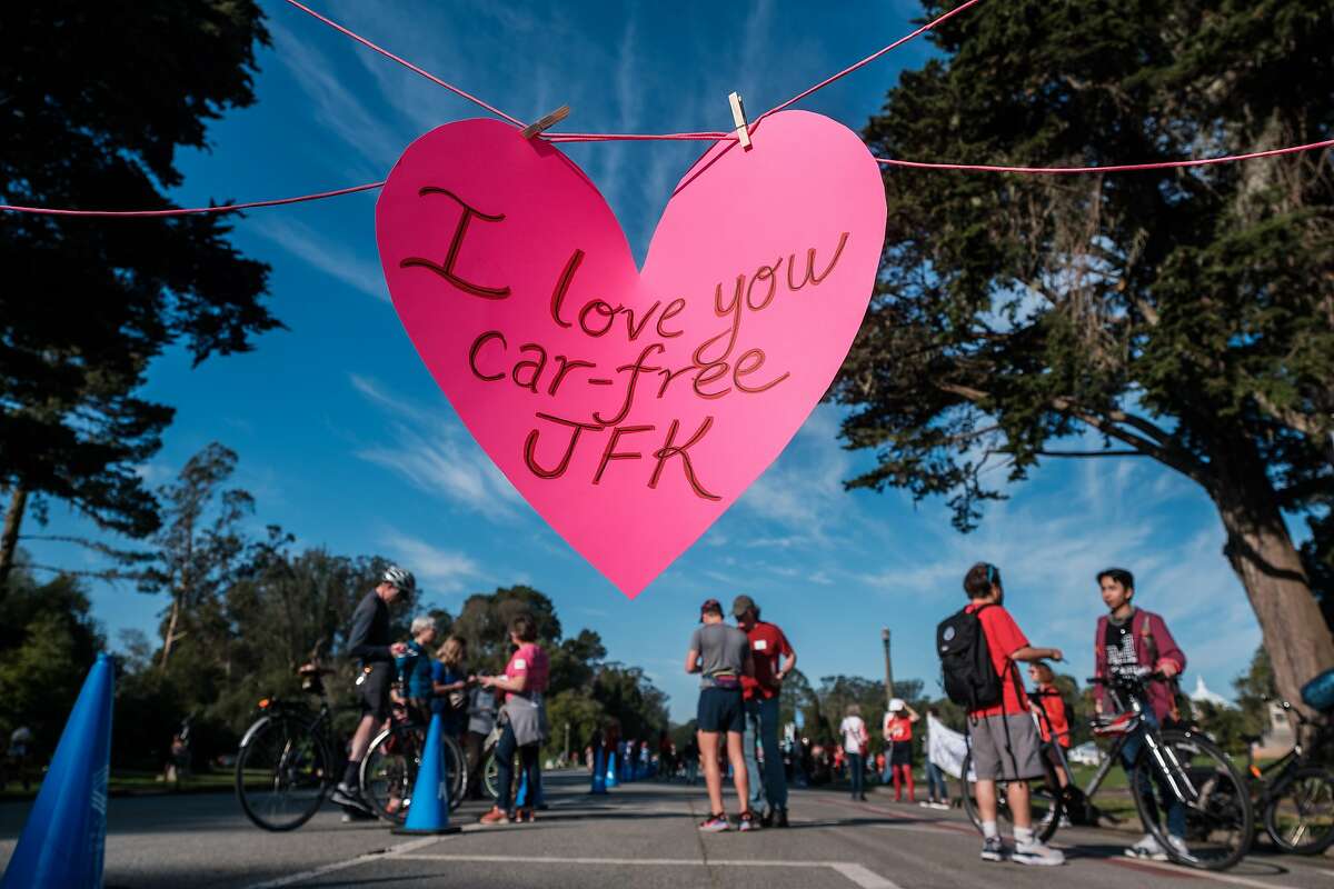 People attend a “Save JFK” rally on JFK Drive in Golden Gate Park on Saturday, February 12, 2022. Members of Walk SF organized the “Save JFK” rally to garner support in an effort to keep JFK Drive car free.