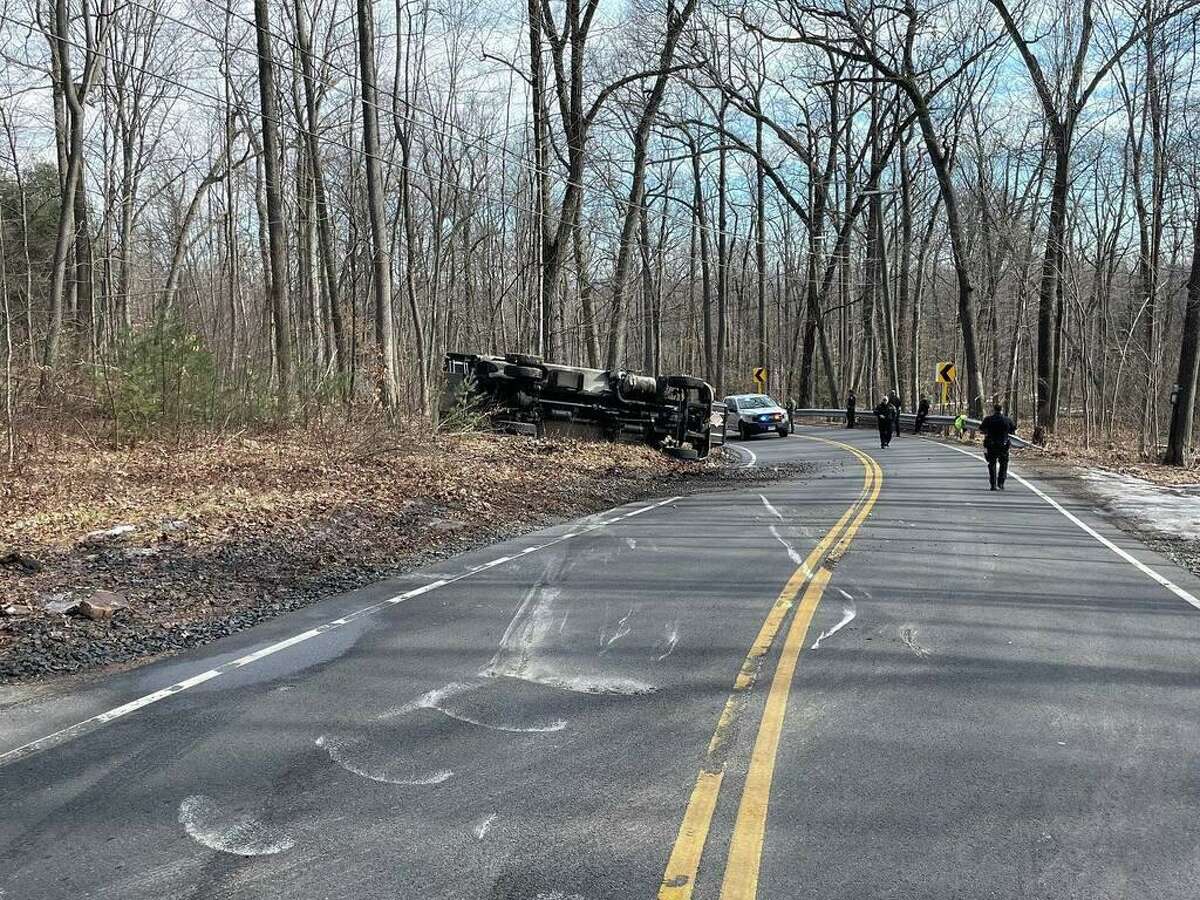 Crews responded to Bethany Mountain Road in Cheshire, Conn., around 11:30 a.m. Friday, Feb. 11, 2022, for a rollover crash involving an oil truck, authorities said.