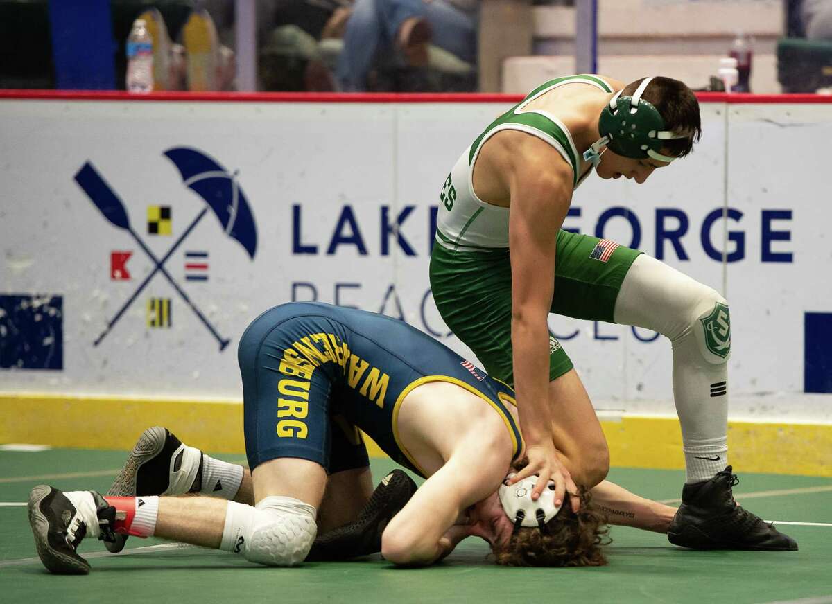 Schalmont's Dylan Devine, right, wrestles Warrensburg/Bolton's Dylan Winchell in the Division II 126-pound final.