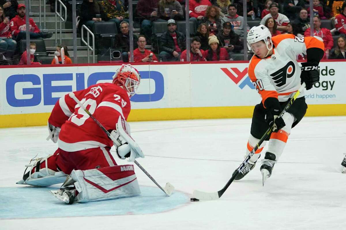 Detroit Red Wings goaltender Thomas Greiss (29) defends against Philadelphia Flyers center Gerry Mayhew (20) in the third period of an NHL hockey game Saturday, Feb. 12, 2022, in Detroit. (AP Photo/Paul Sancya)
