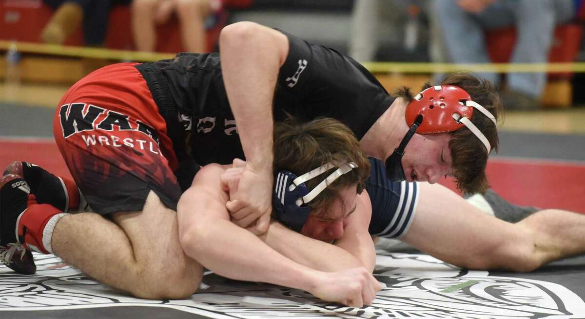 Warde's Will Ebert (top) wrestles Staples' Alex Von Seggern Fiala in the 170-pound quarterfinals at the FCIAC tournament in New Canaan on Friday, Feb. 11, 2022. Ebert went on to win the New England Interscholastic Wrestling Championship meet Saturday, March 5 in Providence.