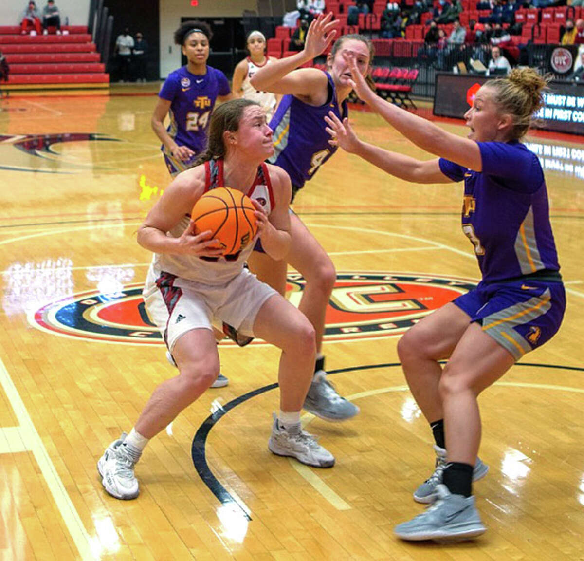 SIUE's Allie Troeckler (left) takes the ball to the basket against Tennessee Tech on Saturday at First Community Arena in Edwardsville.