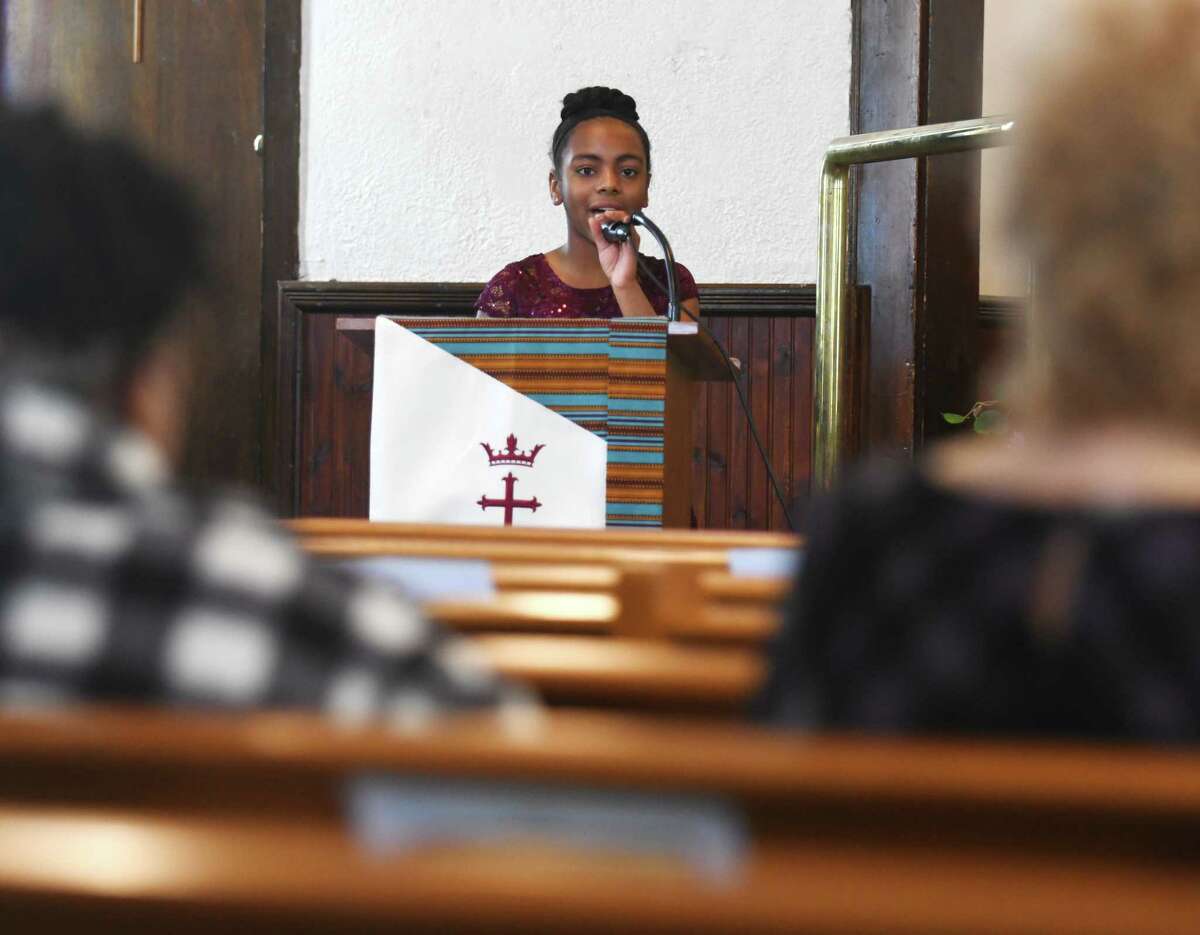 Kaylah Diane Newell, 10, of Hartsdale, N.Y., speaks during a special Black History Month service at First Baptist Church in Greenwich, Conn. Sunday, Feb. 13, 2022. During the service, two young speakers addressed the topic of what it means to be young, gifted, and Black in the year 2022.