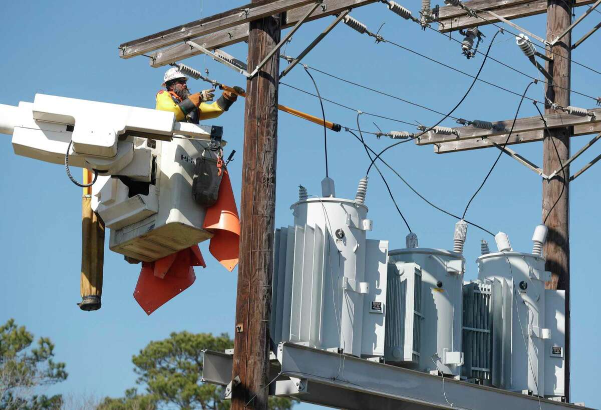 Bright Star Solutions utility line contractors work on power lines for a nearby subdivision Feb. 18, 2021, in Montgomery.