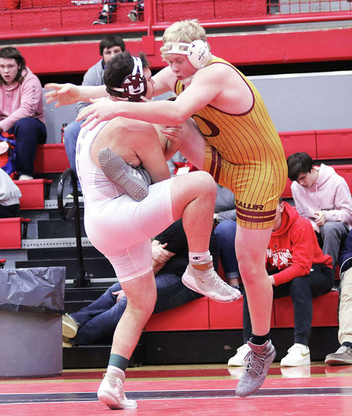 Tolono Unity's Oran Varela (left) gets a leg up on EA-WR's Drake Champlin during their 220-pound third place match Saturday at the Vandalia Class 1A Sectional.