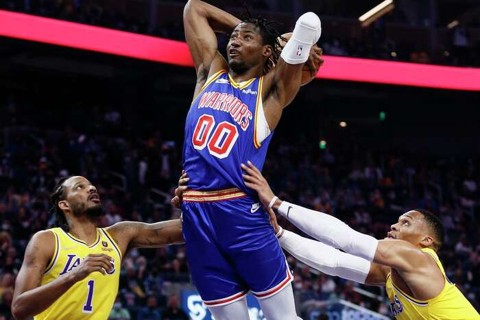 FILE - Golden State Warriors forward Jonathan Kuminga stands on the court  during the second half of an NBA basketball game against the Los Angeles  Clippers Monday, Feb. 14, 2022, in Los