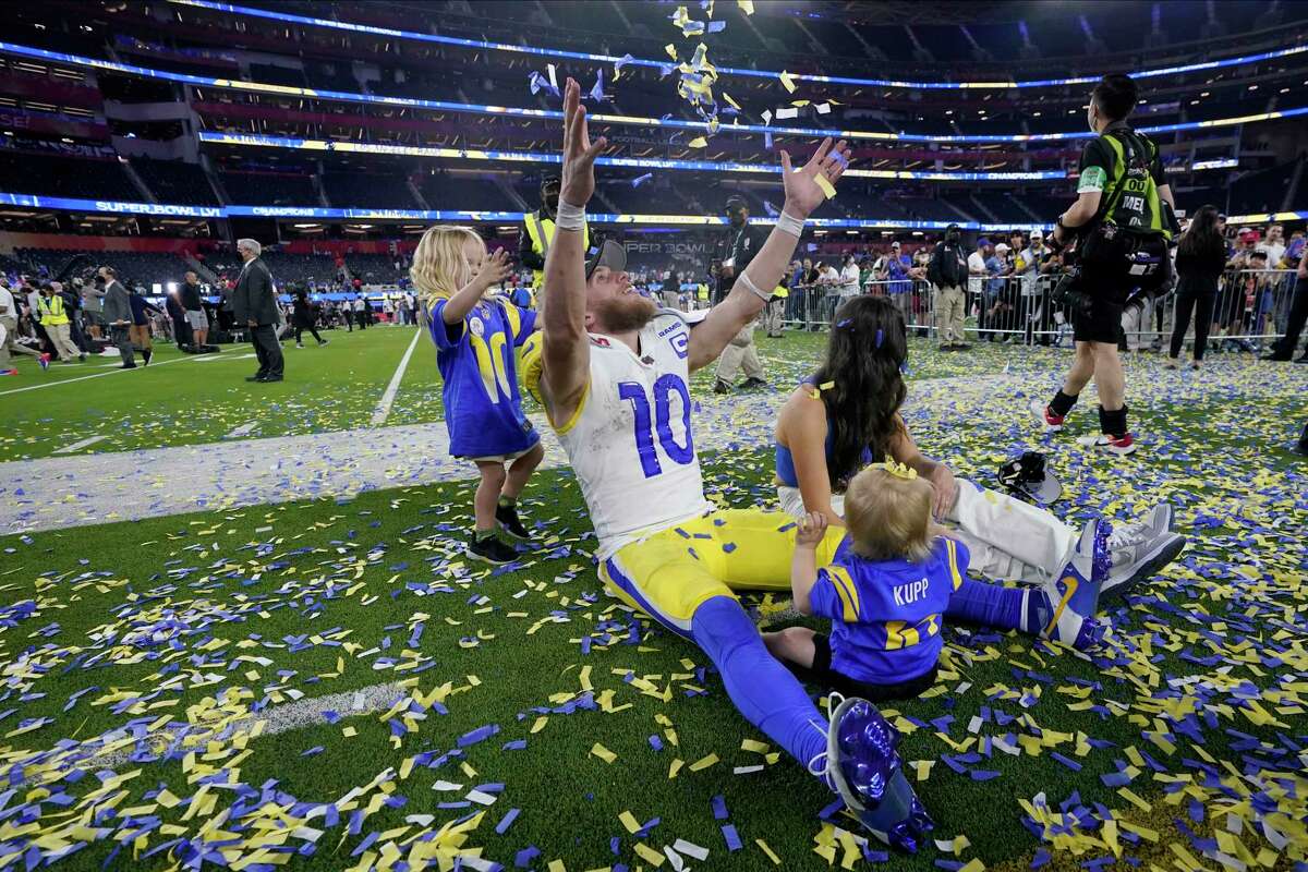 Los Angeles Rams wide receiver Cooper Kupp (10) celebrates with his family after the Rams defeated the Cincinnati Bengals in the NFL Super Bowl 56 football game Sunday, Feb. 13, 2022, in Inglewood, Calif.
