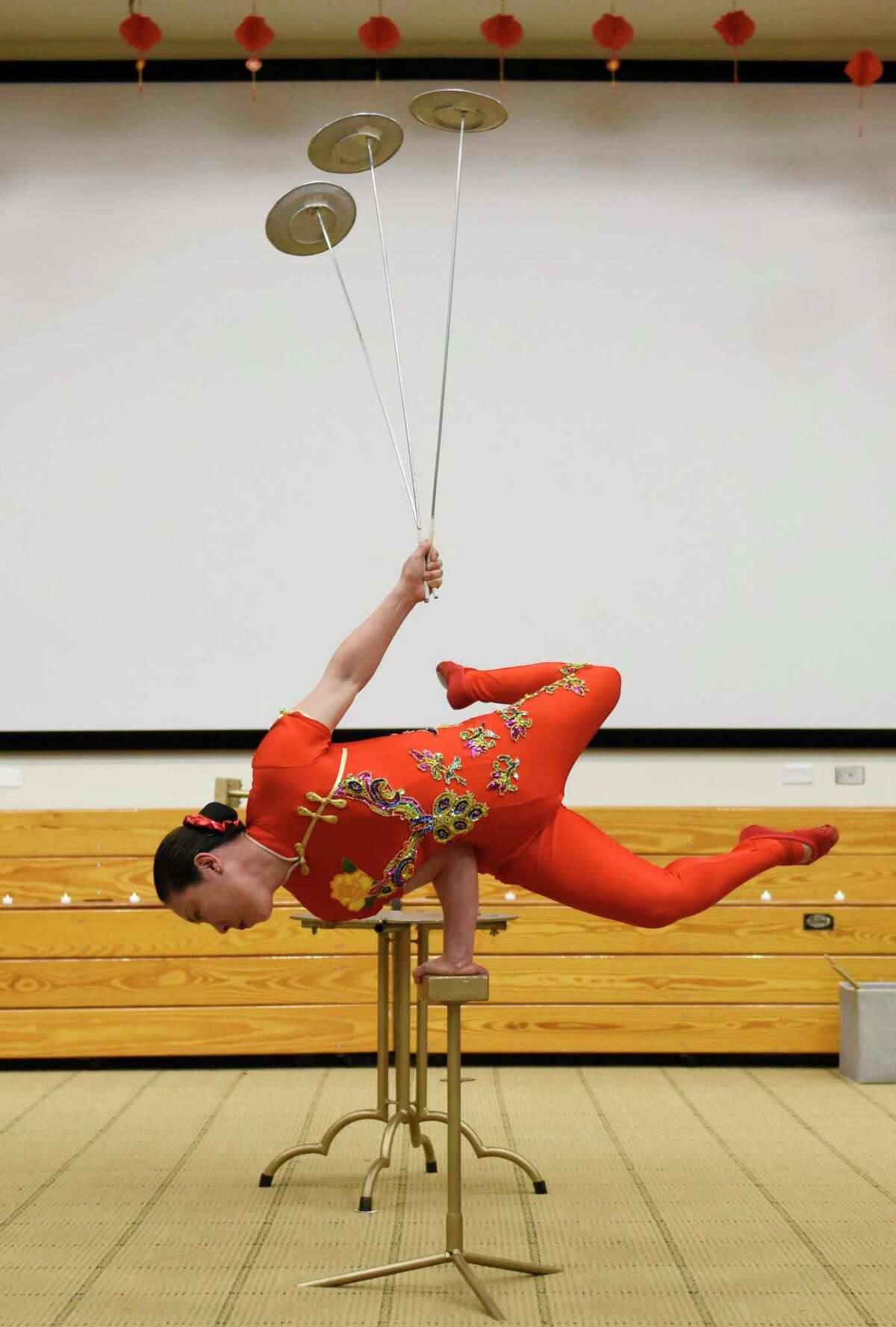 Chinese acrobat Li Liu performs during the Lunar New Year celebration at the Ferguson Library in Stamford, Conn.  Sunday, Feb.  13, 2022. Presented in partnership with Traditional Martial Arts and Club Kung Fu, the event celebrated the Year of the Tiger with activities including a Chinese acrobatic performance and Tae Kwon Do and Wing Tsun Martial Arts demonstrations.