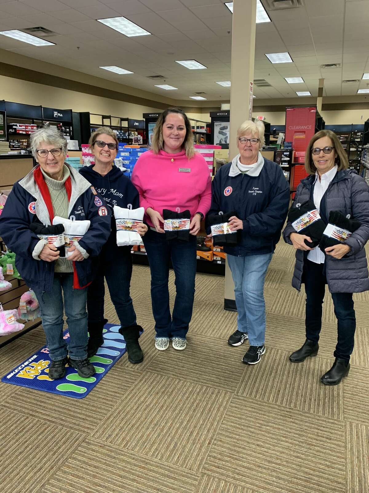 Blue Star Mothers Thumb Chapter MI 178 would like to thank our generous community who purchased and donated 258 pairs of socks while they shopped at Shoe Sensation in Bad Axe. Thank you to Shoe Sensation for sponsoring this event. We will be able to send our troops extra socks in their care packages and also be able to give to our local veterans who are in need. Pictured are BSM Grace Rosenthal, BSM Marcia Janik, Store Associate Megan Walker, BSM Lynne Tschirhart, BSM Debbie Decker.