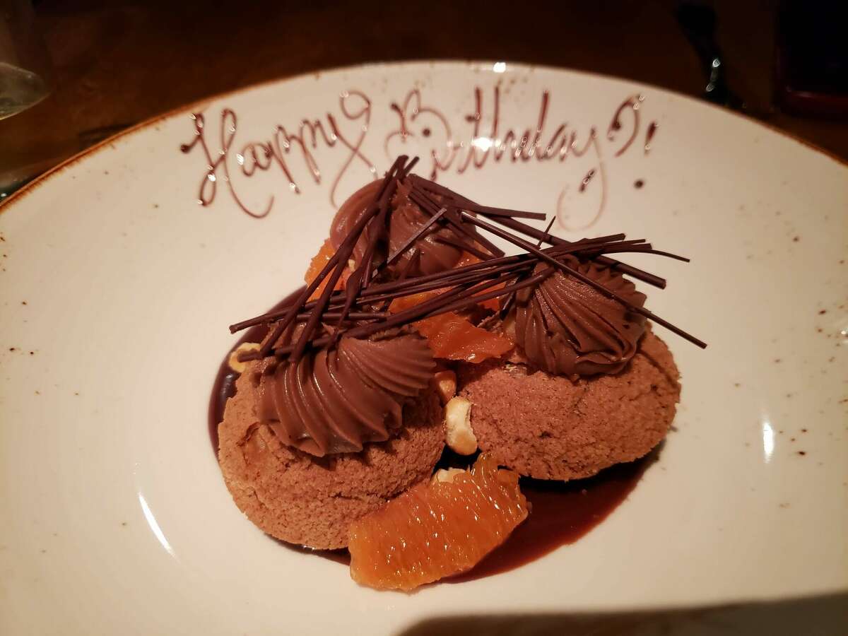 The chocolate cream puffs were filled and topped with coffee ganache and decorated with hazelnuts, chocolate curls and orange slices at Millwright’s in Simsbury. 