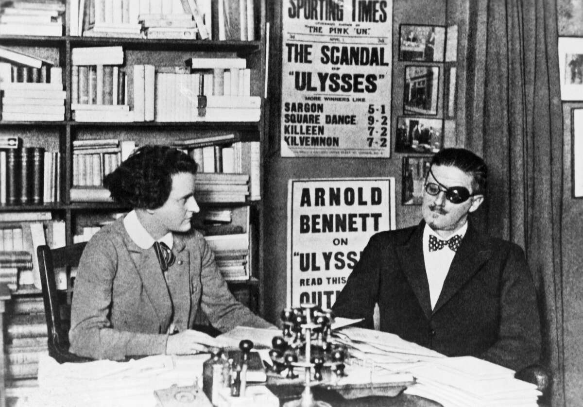 Author of Ulysses James Joyce and his publisher Sylvia Beach in an office in Paris.