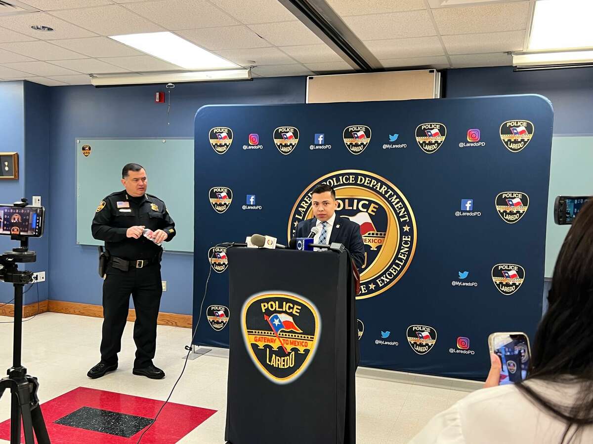 Laredo Police Department Public Information Officer Joe Espinoza is pictured at a podium with Police Chief Claudio Trevino Jr. at a press conference Monday, Feb. 14, 2022 regarding the triple homicide one day earlier outside of TKO Sports Cafe.