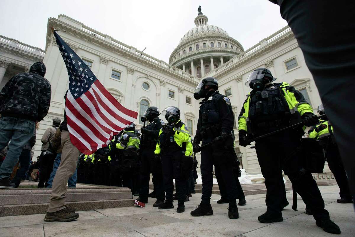 FILE - U.S. Capitol Police officers push back rioters who were trying to break into the U.S. Capitol on Jan. 6, 2021, in Washington. New internal documents provided by former Facebook employee-turned-whistleblower Frances Haugen provide a rare glimpse into how the company, after years under the microscope for the policing of its platform, appears to have simply stumbled into the Jan. 6 riot (AP Photo/Jose Luis Magana, File)