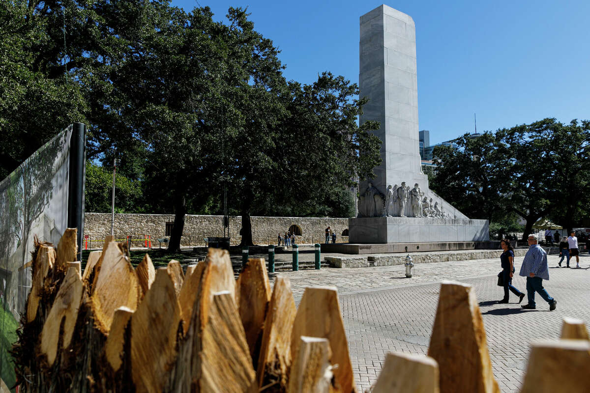 People walk by the Alamo Cenotaph monument, also known as "The Spirit of Sacrifice," at the Alamo Mission Complex in Downtown San Antonio. Pretty soon officials will inspect damage that has occurred over time.