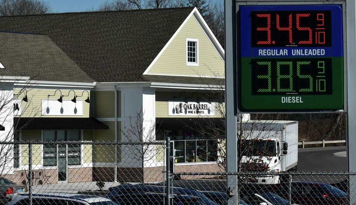 A Newtown, Conn. gas station advertises a price of just under $3.46 for a gallon of regular, on Friday, Feb. 11, 2022, in line with other nearby stations. Fuel prices eased in January but remain up 40 percent nationally, one of several categories where households and businesses are having to shell out more amid a 40-year high in inflation.