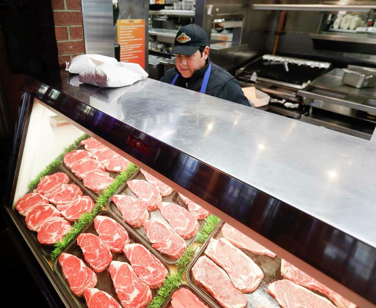 Butchers competing in Meat Cutter Challenge held in Tampa Bay 