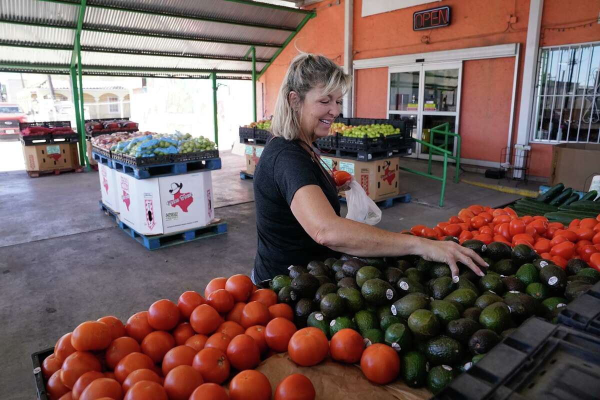 Debra Carrola shops for avocados at Chicho Boys Fruit Market Monday afternoon. On Saturday, the United States suspended imports of Mexican avocados.