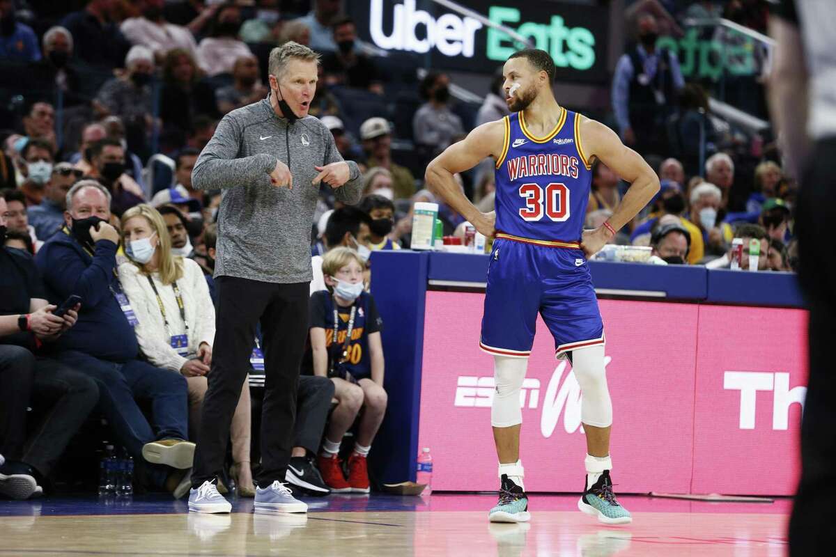 Golden State Warriors head coach Steve Kerr with Warriors guard Stephen Curry (30) in the second half of an NBA game against the Los Angeles Lakers at Chase Center, Saturday, Feb. 12, 2022, in San Francisco, Calif. The Warriors won 117-115.