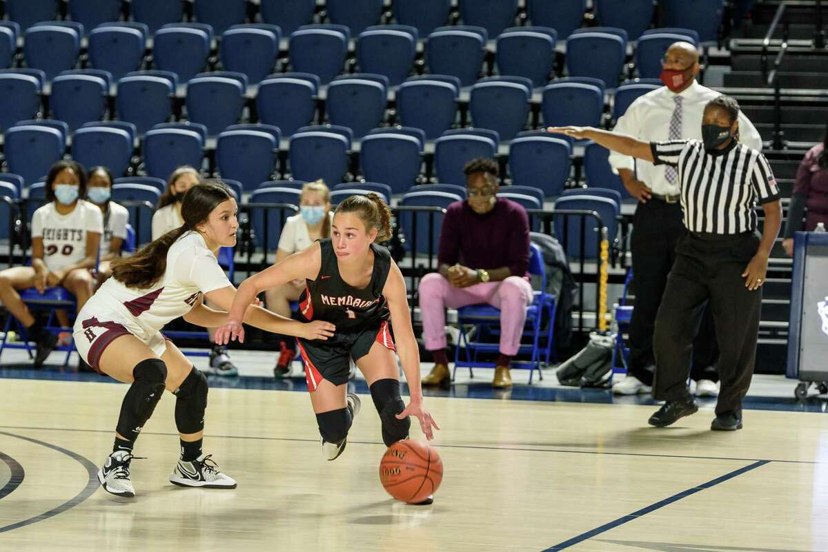 Memorial's Riley McCLoskey (1) finished with 13 points in the Lady Mustang's 81-35 bi-district playoff win over Heights at Delmar Fieldhouse on Feb. 14.