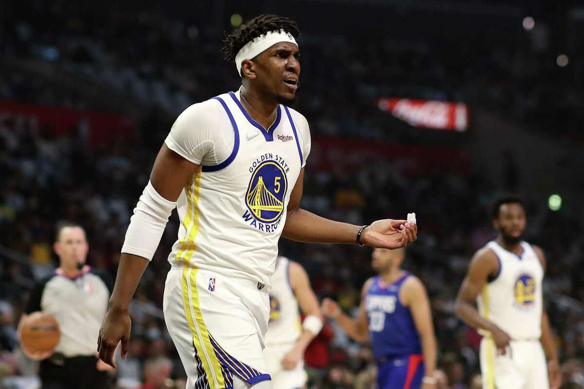 LOS ANGELES, CALIFORNIA - FEBRUARY 14: Kevon Looney #5 of the Golden State Warriors reacts to a play during the first quarter against the Los Angeles Clippers at Crypto.com Arena on February 14, 2022 in Los Angeles, California.