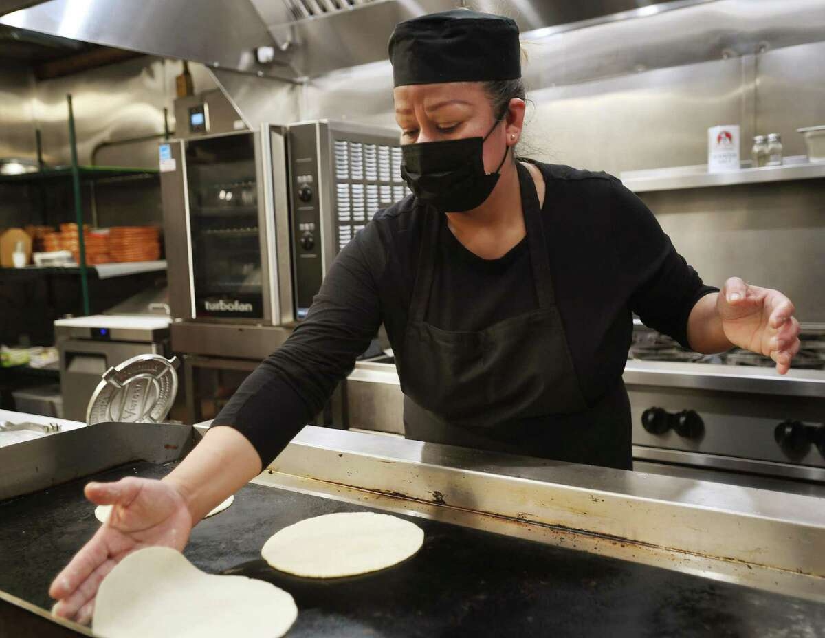 Dora Lanche cooks handmade corn tortillas at the new VivaZ Cantina Mexican restaurant at 161 Park St. in New Haven Feb. 10, 2022.