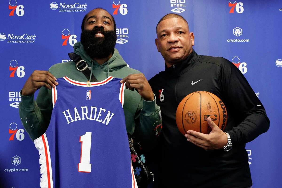  James Harden #1 and head coach Doc Rivers of the Philadelphia 76ers pose for photos during a press conference at the Seventy Sixers Practice Facility on February 15, 2022 in Camden, New Jersey.