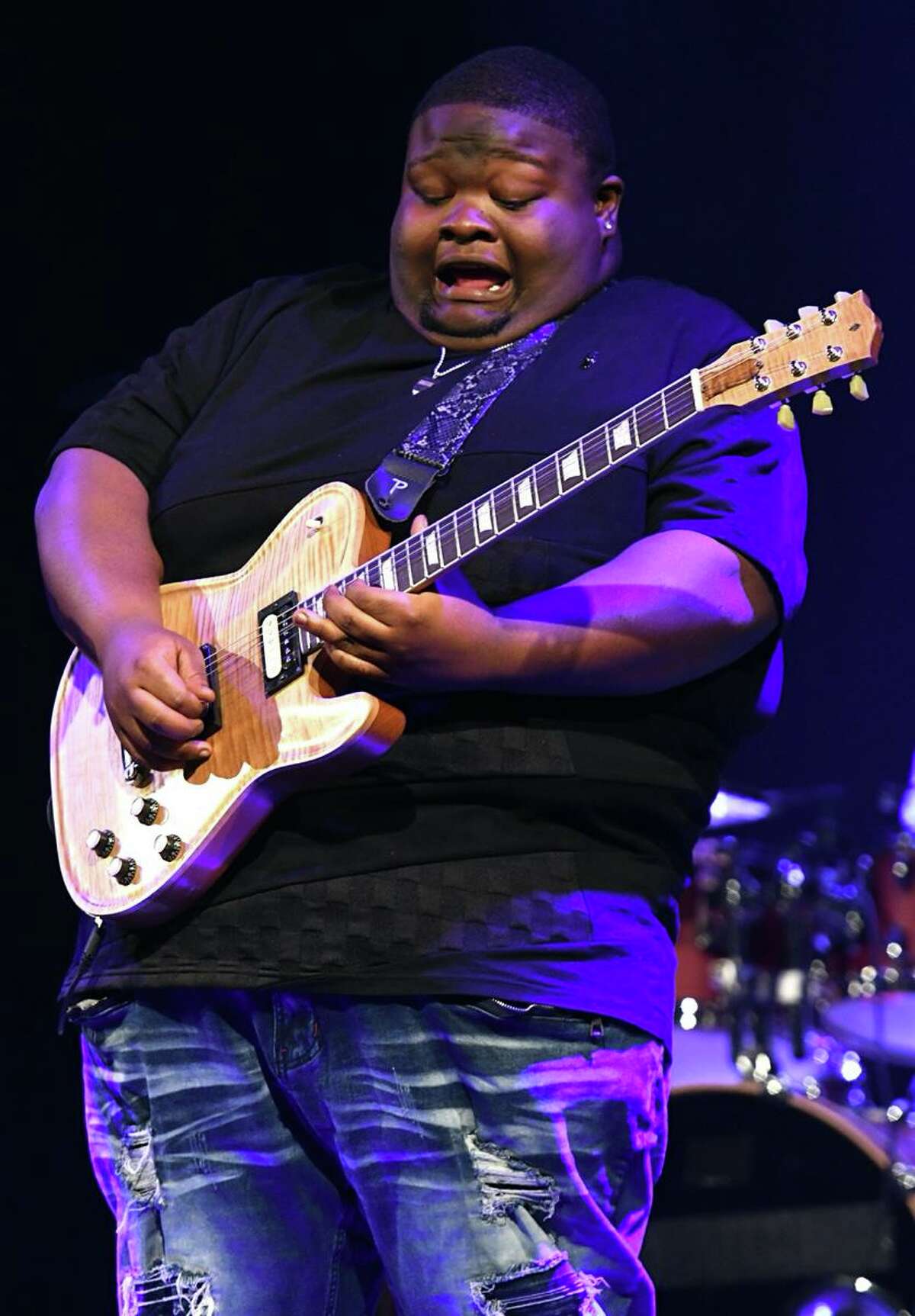 Blues guitarist, singer and songwriter Christone “Kingfish” Ingram is shown performing on stage during his live show  Feb. 11 at Infinity Hall in Hartford. His debut album, Kingfish, was released in May 2019. In addition to his own album, musicians he has recorded with include Buddy Guy, Eric Gales and Keb Mo. He has shared the stage with well known blues artists and younger blues musicians such as the Tedeschi Trucks band, Samantha Fish, Bob Margolin and Rick Derringer. To learn more about Kingfish, go to  www.christonekingfishingram.com