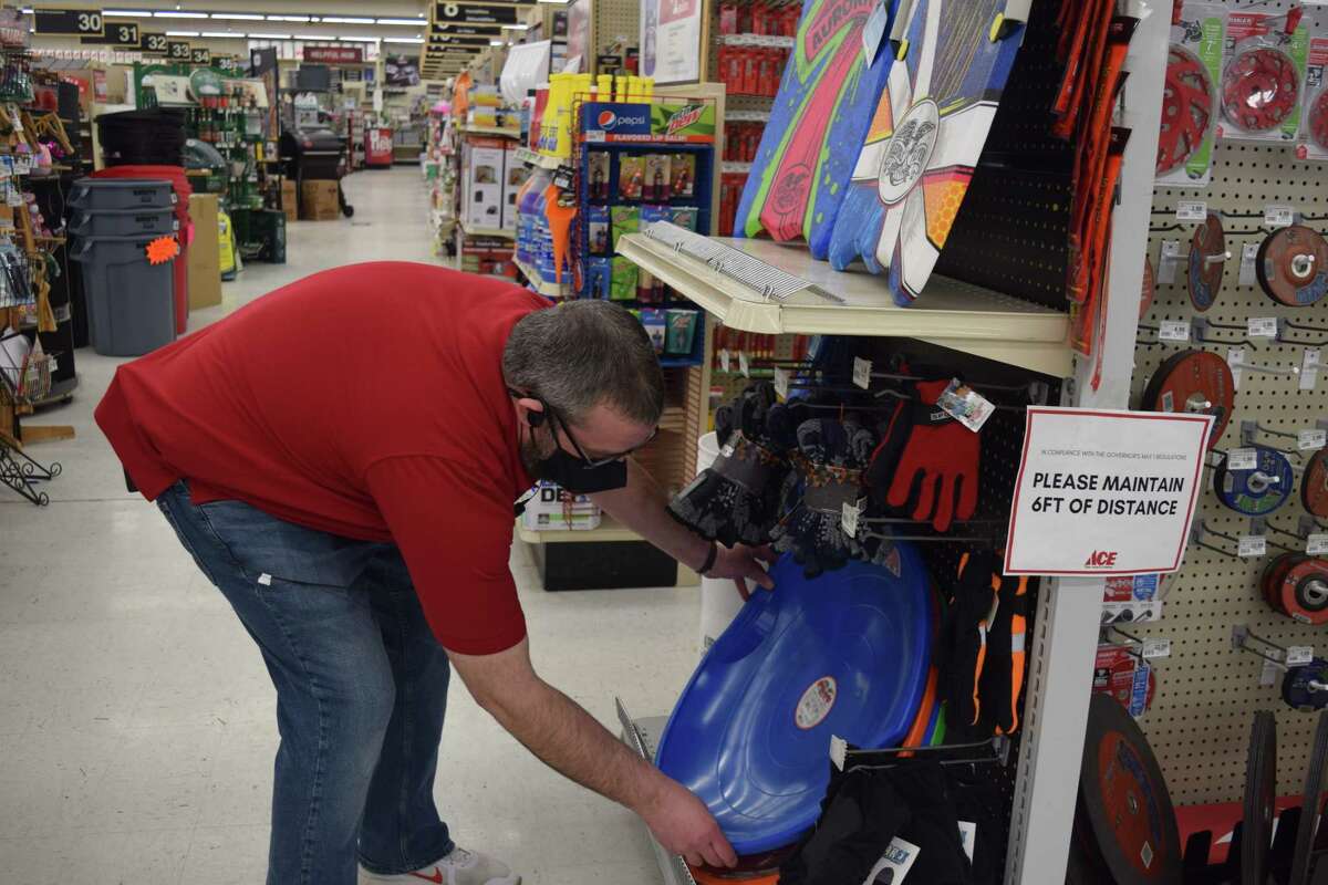 Jared Evans, an assistant manager at Ace Hardware in Jacksonville, works Tuesday on organizing the store's stock of sleds. Forecasters are watching a winter storm that is expected to move into the Jacksonville area staring tonight with rain changing to freezing rain and then to snow. A winter storm watch will take effect at 6 p.m. today, with about 3 inches of accumulation possible by Thursday, according to the National Weather Service.