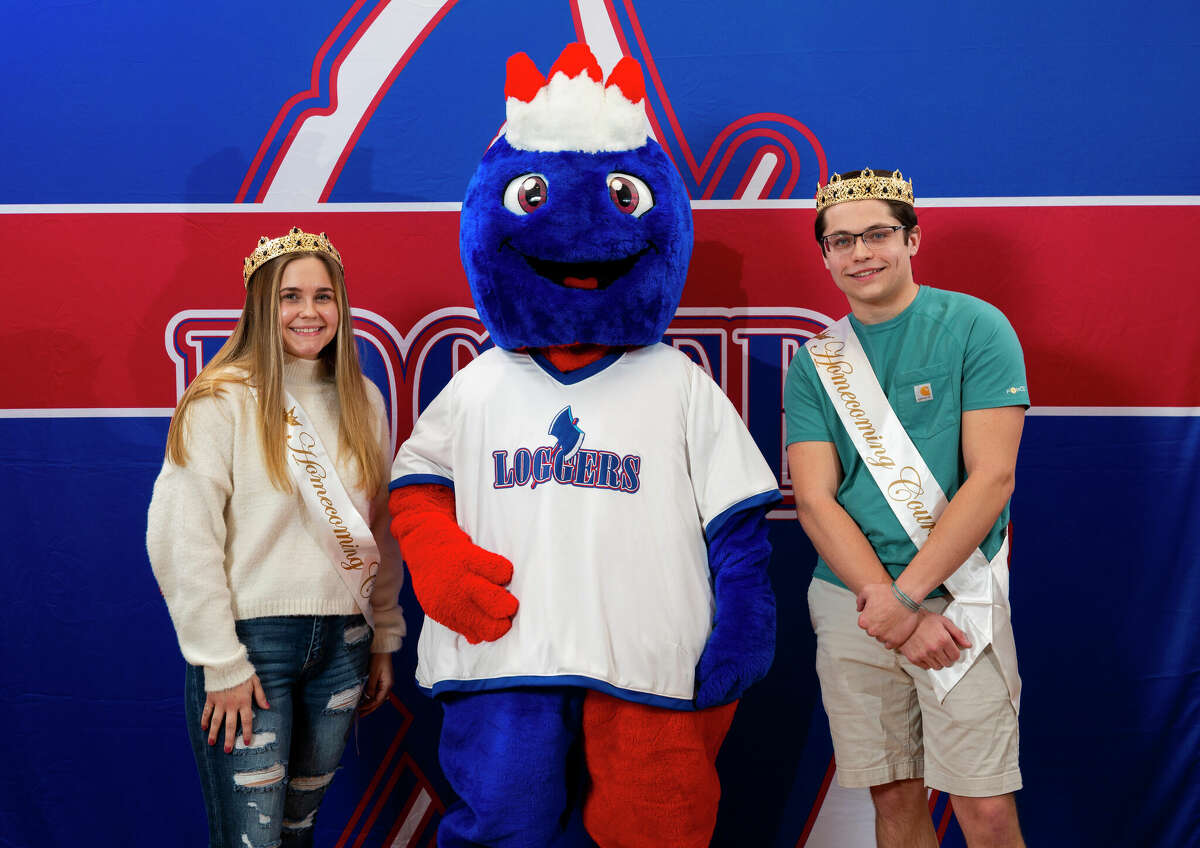 Lincoln Land Community College's new mascot, Linc, is introduced with homecoming royalty Hannah Williams (left) of Pawnee and Alex White (right) of Girard.