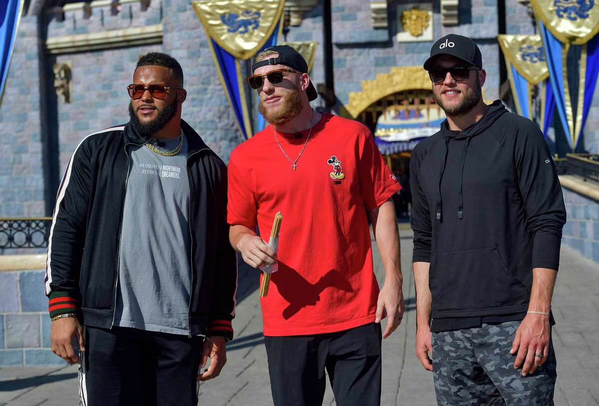 Los Angeles Rams' Aaron Donald, left, NFL football's Super Bowl 56 MVP Cooper Kupp, center, and Matthew Stafford, right, answer questions during a media Q&A at Disneyland in Anaheim, Calif., Monday, Feb. 14, 2022. The Rams defeated the Cincinnati Bengals in the Super Bowl on Sunday. (Jeff Gritchen/The Orange County Register via AP)