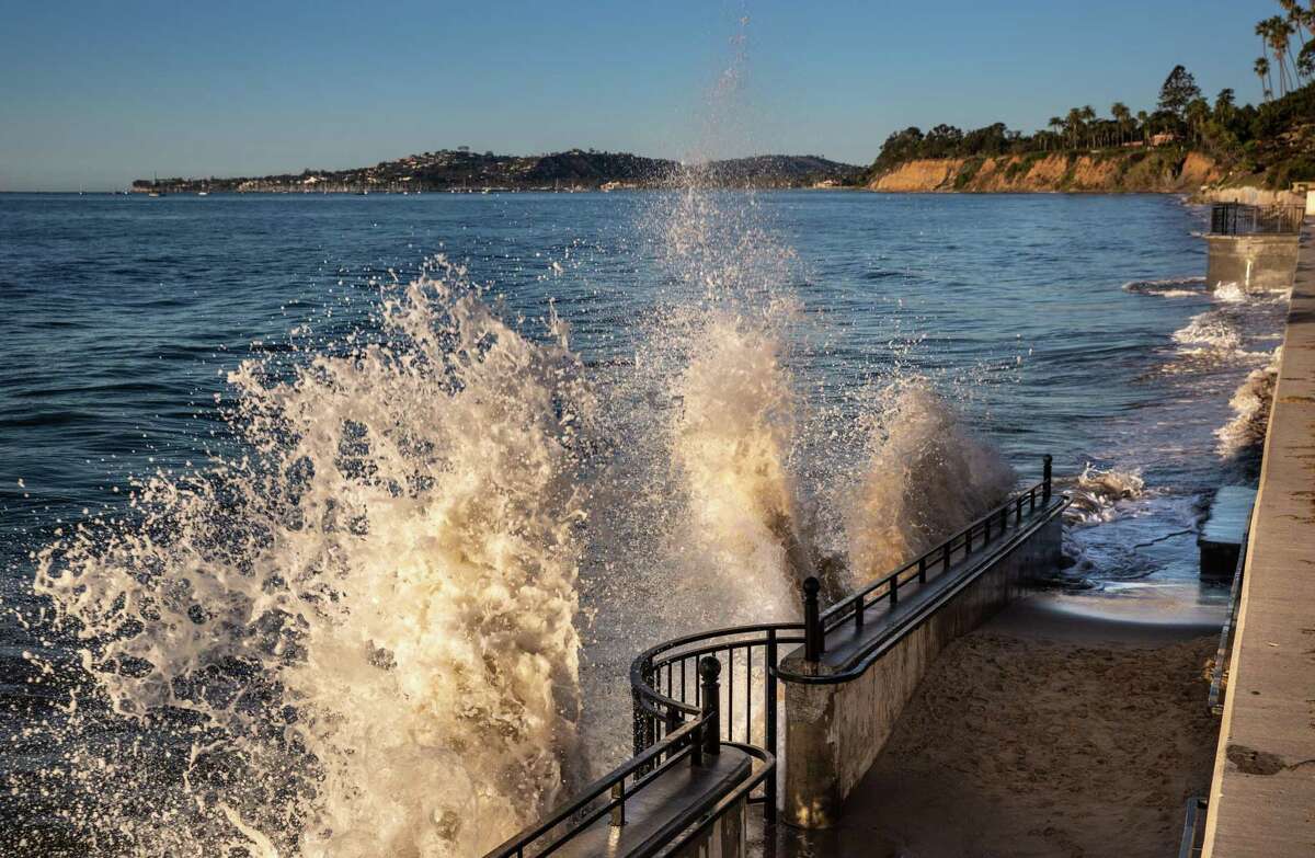 An unusually high king tide of nearly 7 feet pushes waves against the seawall at Butterfly Beach in Santa Barbara on Jan. 18. Increased coastal flooding because of sea level rise is expected in the next few decades.
