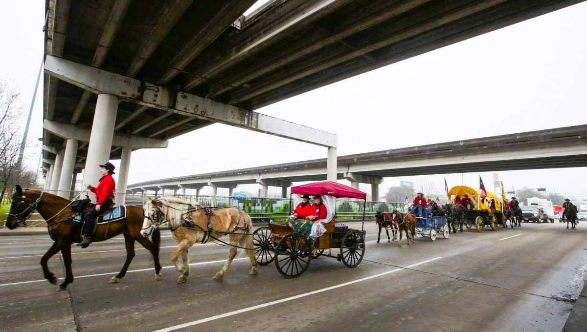 The Texas Independence Trail Riders make their way under an overpass. The trail riders will be journeying from La Marque to Houston Feb. 18-25 to celebrate the Houston Livestock Show and Rodeo.