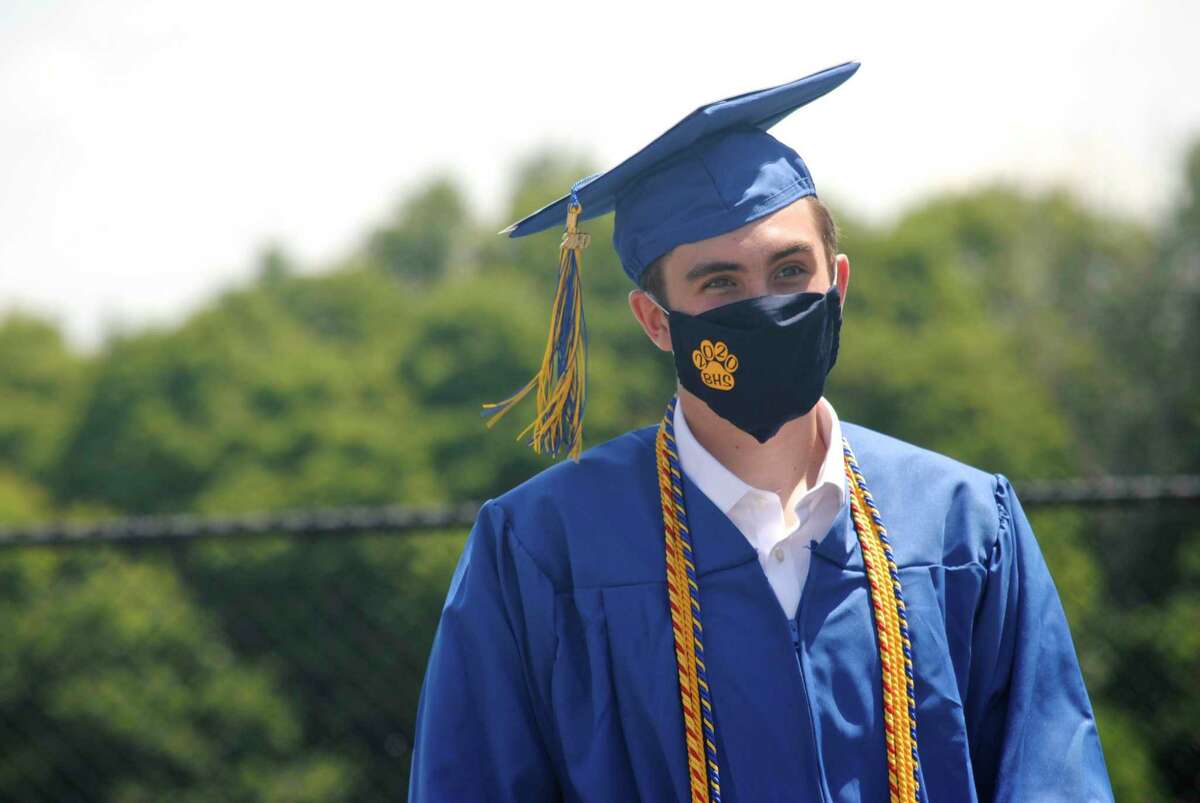 Brian Ritter wears a Brookfield mask as he waits to receive his diploma. On March 1, the school district will no longer require students and staff to wear masks.