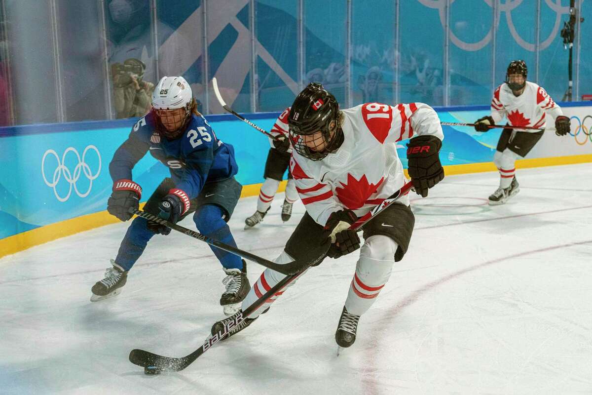 Alex Carpenter (left) and the United States take on Brianne Jenner and Canada in the gold-medal match in women’s hockey at 8 p.m. Wednesday (Channels 11, 3, 8).
