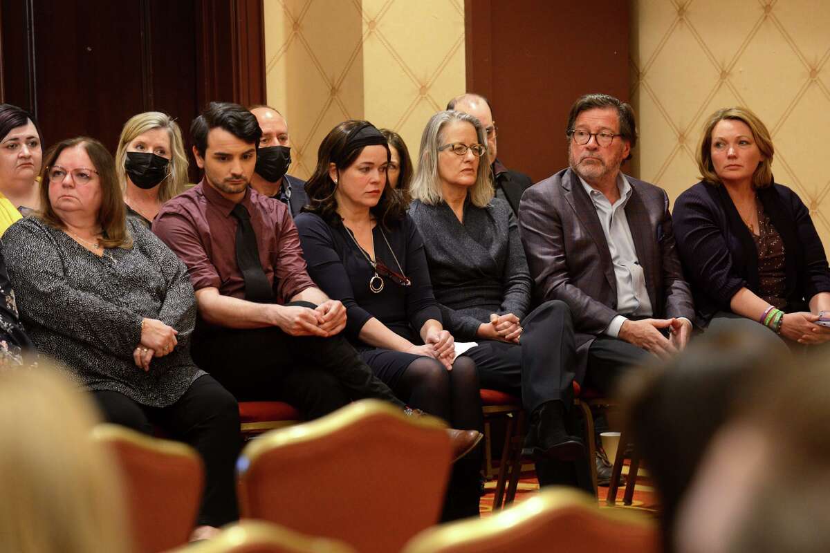 Family members of Sandy Hook Elementary School victims attend a news conference in Trumbull, Conn. Feb. 15, 2022. Nine families of Sandy Hook victims have agreed to a $73 million settlement in their wrongful lawsuit against defunct gunmaker Remington.