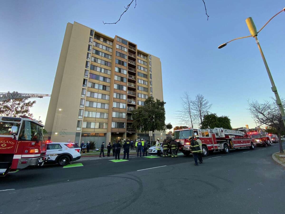 Four people, including two Oakland firefighters, were taken to local hospitals after a fire broke out in an Oakland Housing Authority Building residential tower on Tuesday afternoon, fire officials said.